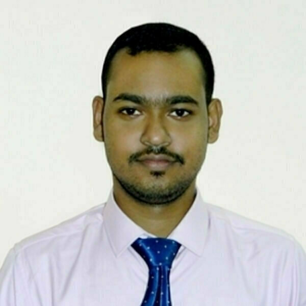 Headshot of Indranil Bera, a man with short dark hair, a mustache, and goatee, wearing a white collared shirt and a dark blue tie